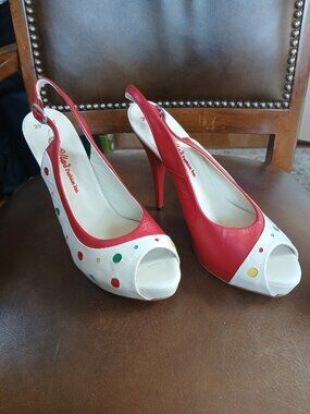 Cute leather pumps in Red and cream . New and Unworn.